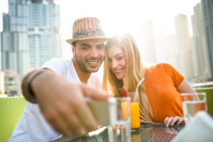 couple flirting at cafe in dubai marina